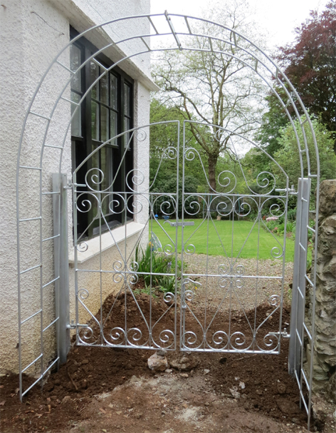 wroughr iron arch with gate