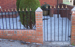 traditional wrought iron garden gate with matching railings